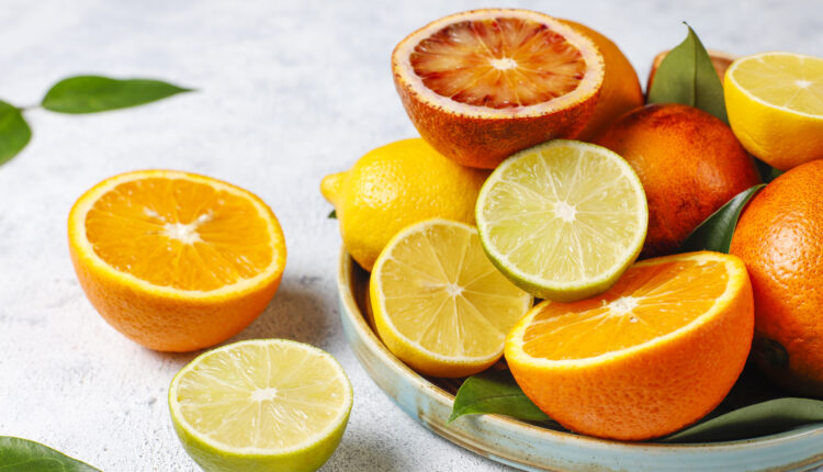 Citrus background with assorted fresh-citrus fruits,lemon,orange